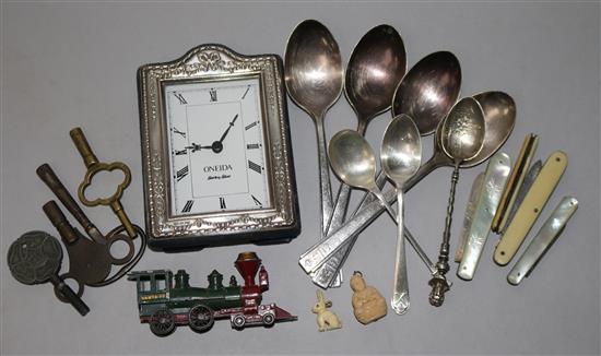 A silver mounted clock, spoons, penknives etc